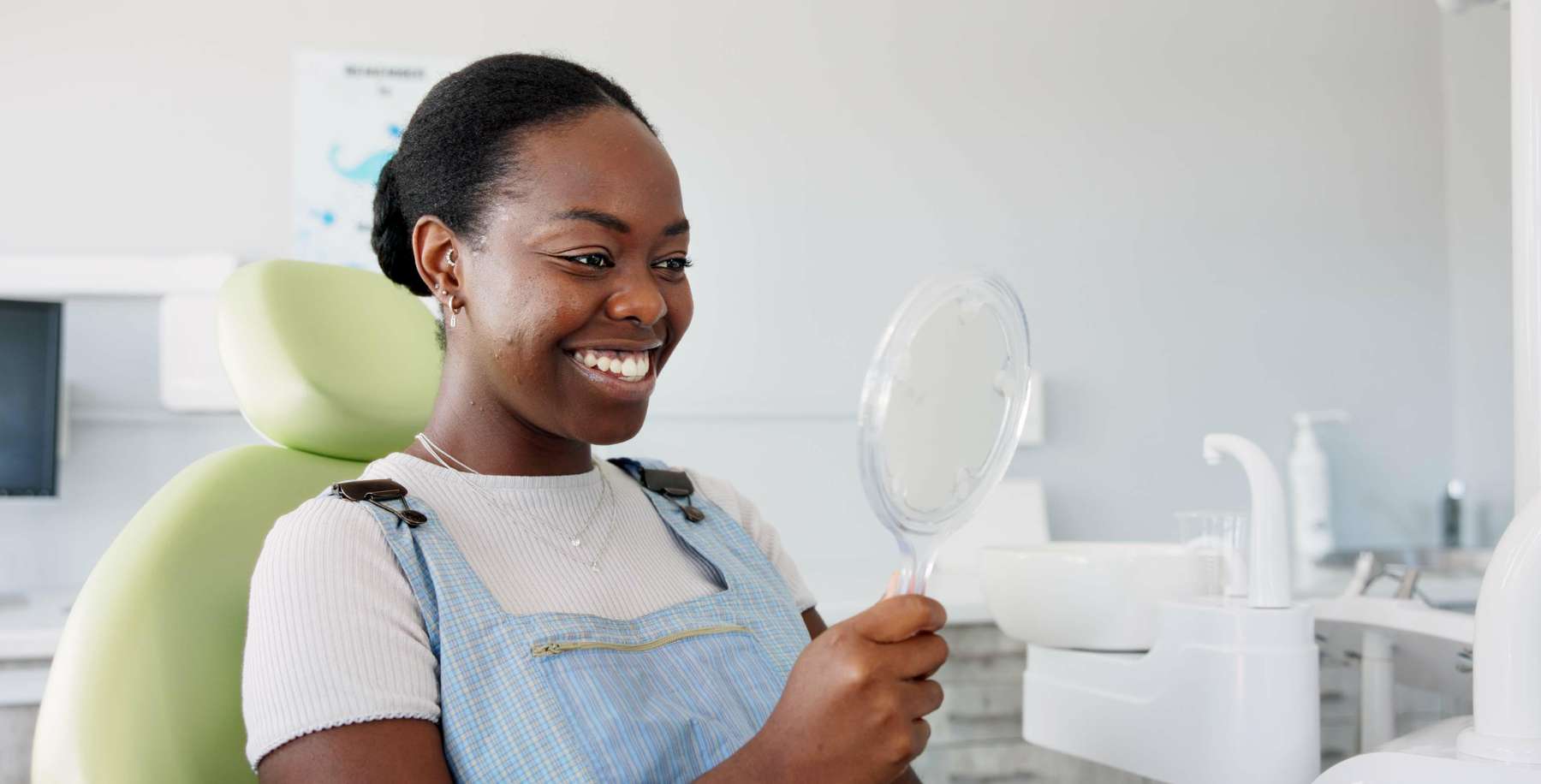 patient looking in mirror after exion facial
