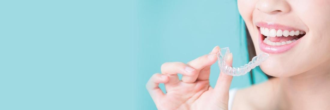 woman trying on clearcorrect invisible aligners | North Tampa Dentist