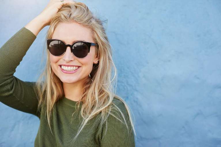 woman with healthy teeth and undamaged dental crown