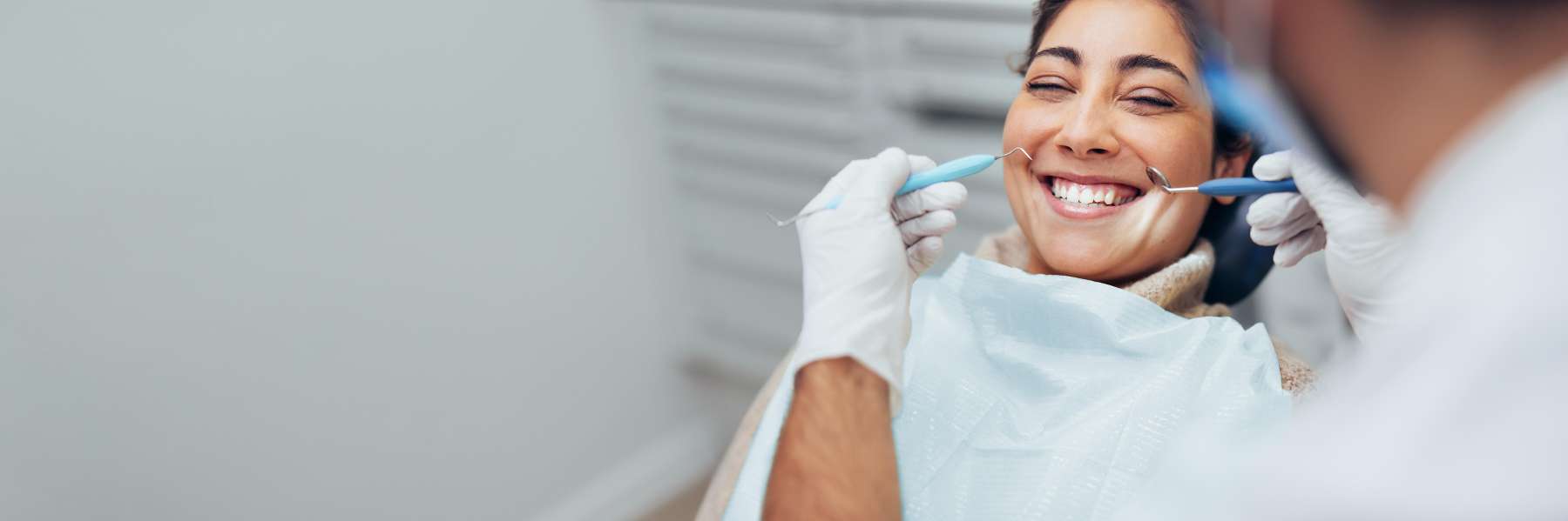 Woman smiling after emergency dental care in Tampa, FL