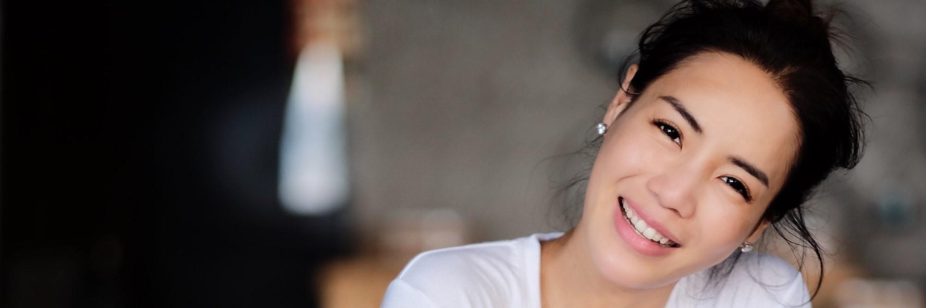 Patient smiling after teeth whitening procedure in Tampa, FL