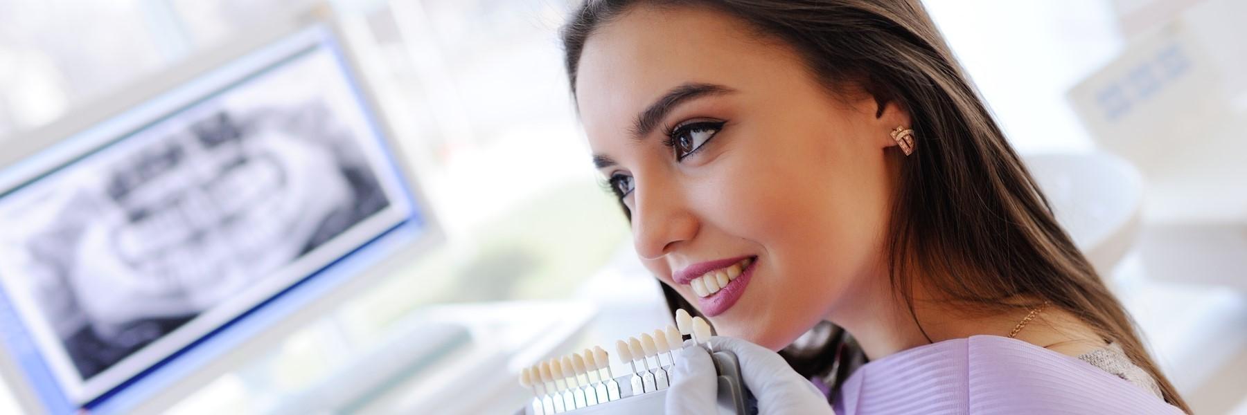 Patient testing shades for teeth whitening in North Tampa